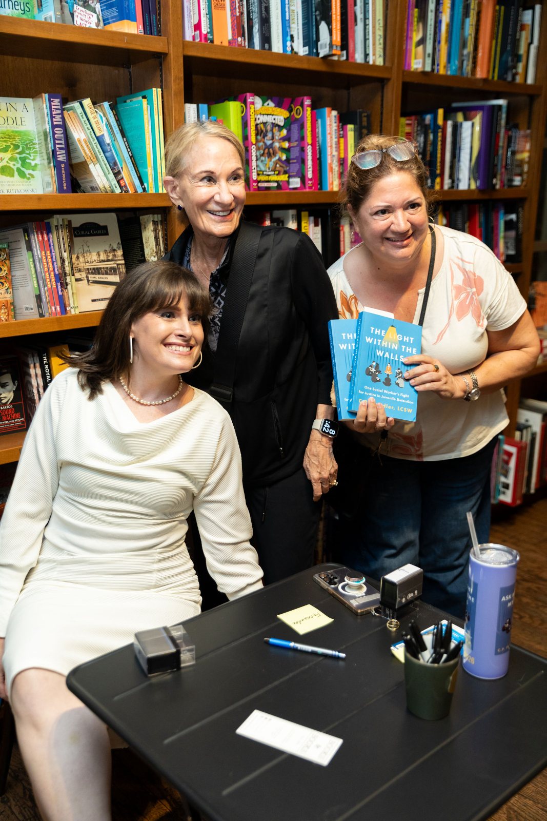 C.P. Handler with a reader at Books & Books